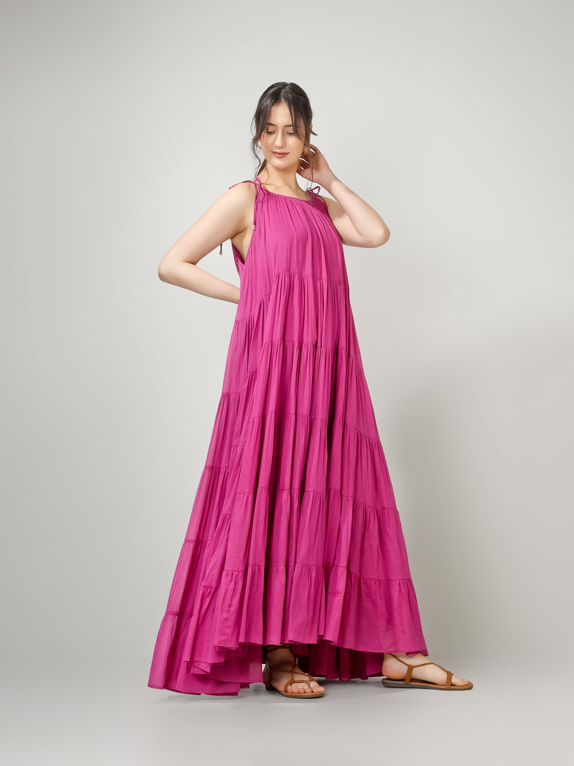 Rani pink sleeveless flowy maxi dress for wedding celebrations and festive get-togethers.
