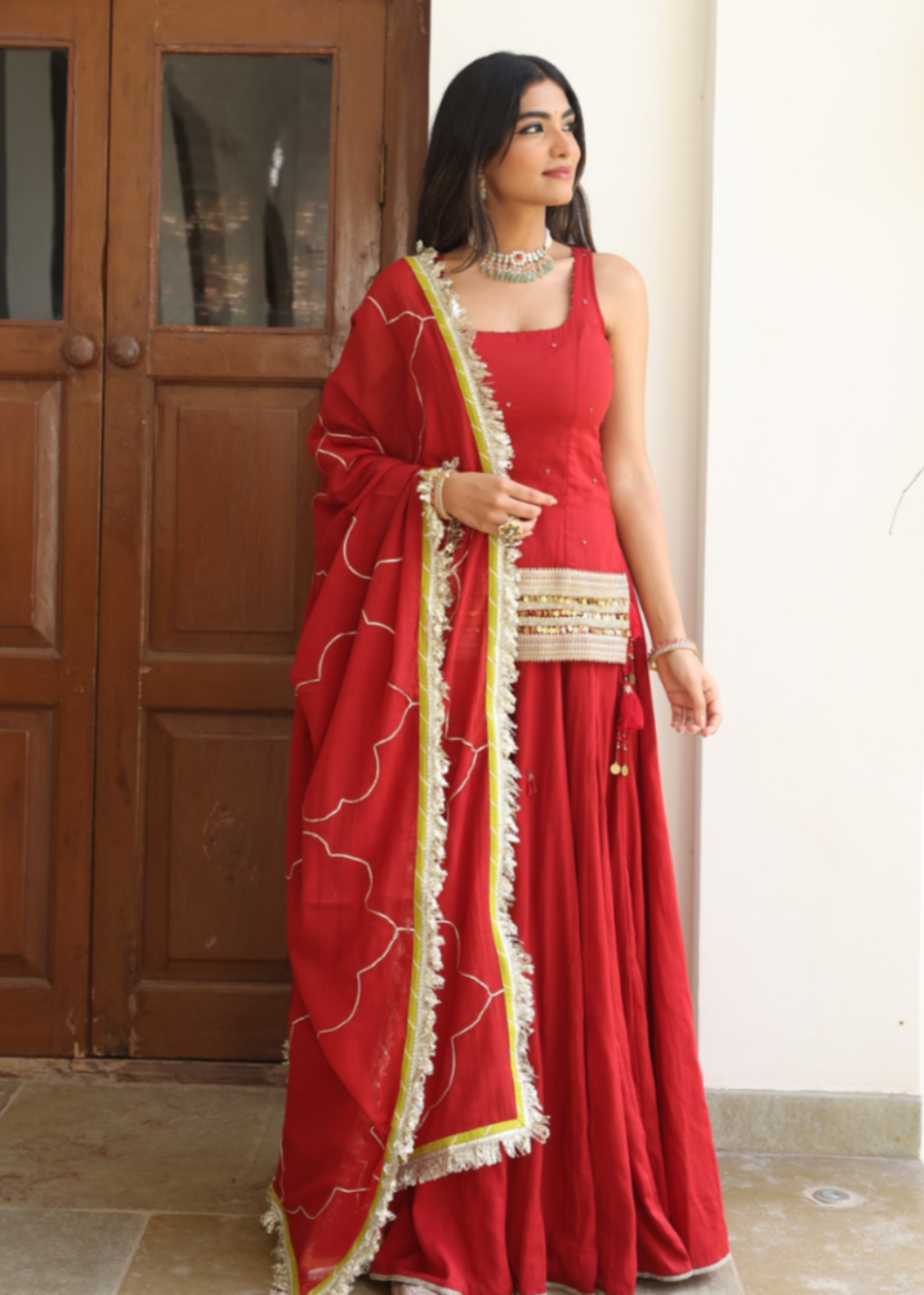 Red short kurta with flared skirt and mulmul dupatta for women by JOVI India